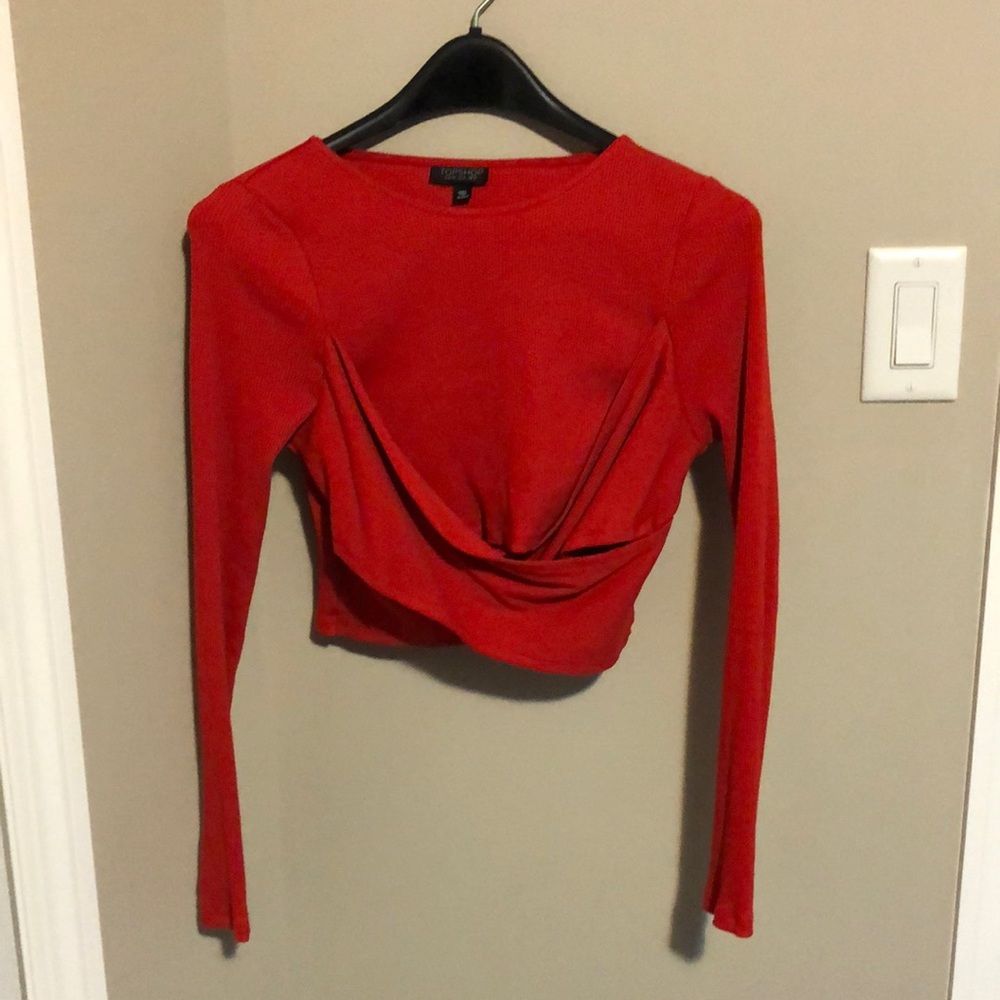 Medium Top Shop cropped long sleeve. Red. Size medium. With cross body design.